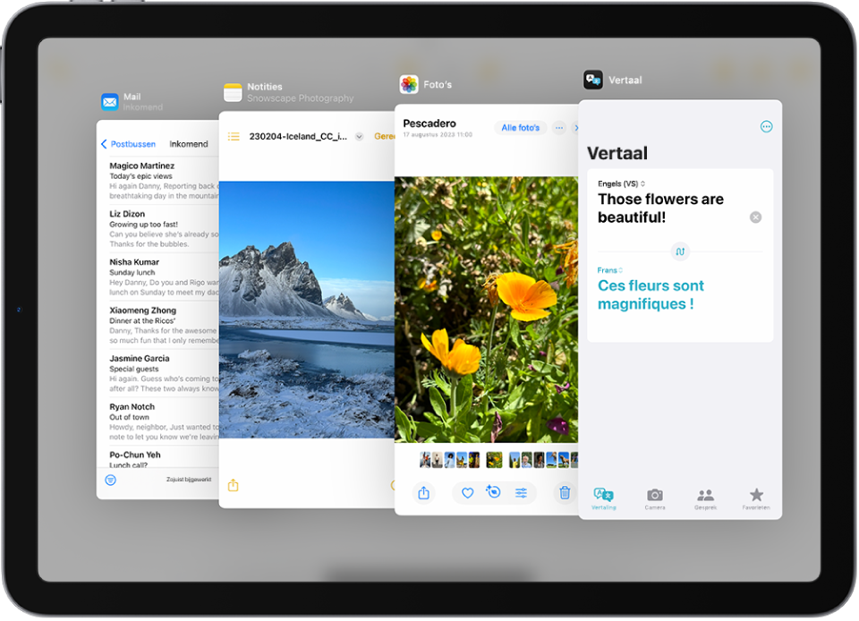 Vier apps die geopend zijn in Slide Over-vensters: Mail, Foto's, Vertaal en Notities.