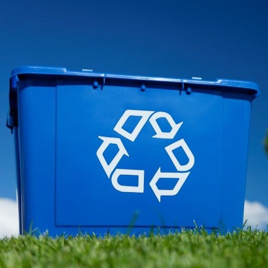 a large blue box on a grassy lawn