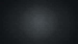 Dark textured wallpaper with subtle gradient and fine dot pattern. — Solid Dark Grey Wallpaper