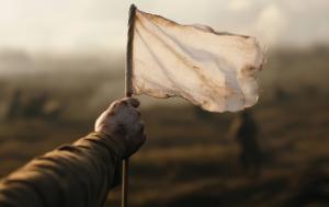 waving white flag hanged by a hand