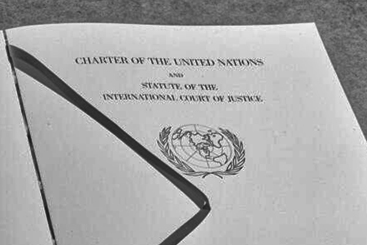 archival photo of the first page in the Charter of the United Nations
